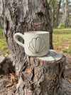 Shell Ceramic Mug: Right-handed design Wolf and Clay Pty Ltd 